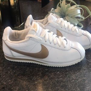 White and gold Nike Cortez sneakers